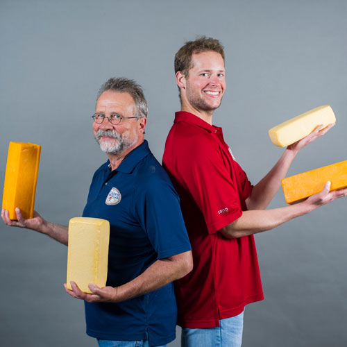 Father and son, Joe and Joey Widmer, have fun with Widmer’s Cheese Cellars’ award-winning cheese.